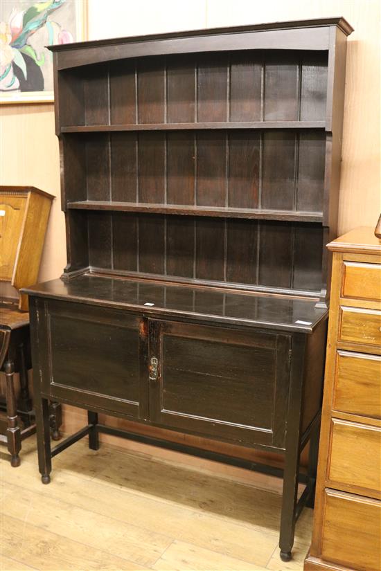 A 1920s ebonised oak dresser W.122cm